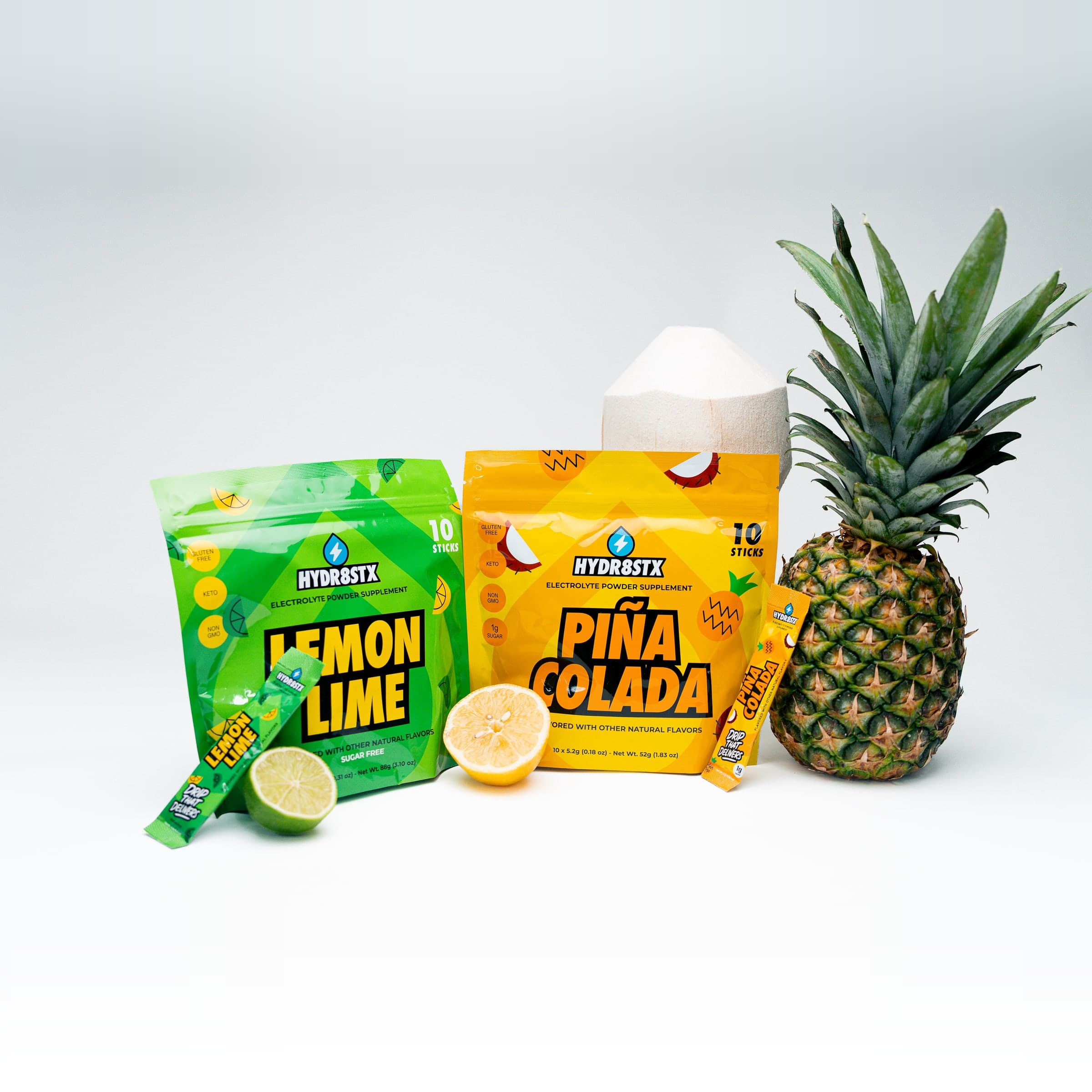 Hydr8Stx Lemon Lime and Piña Colada pouches with fresh fruit